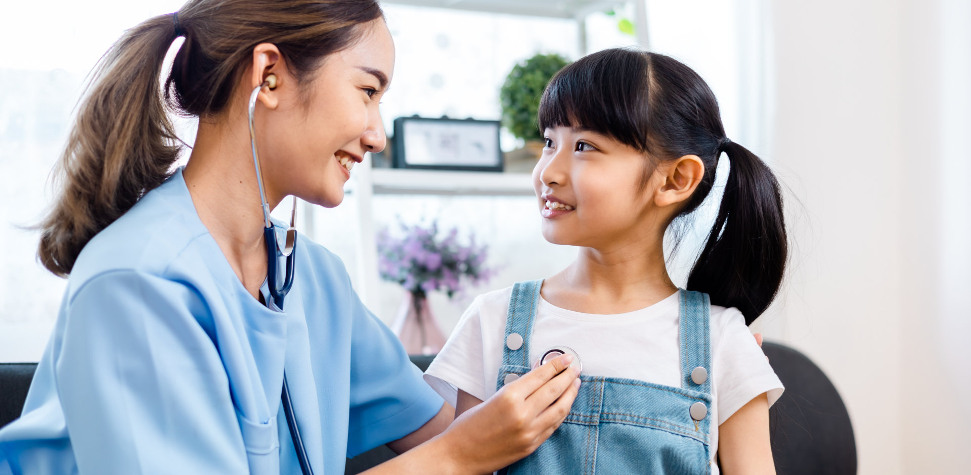 female nurse diagnosing a child